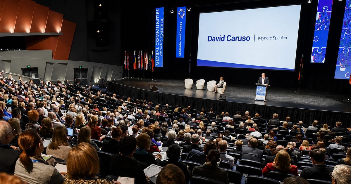 David Caruso speaking to a conference audience